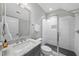 Bathroom featuring a glass shower with tiled walls, a modern vanity, and a large mirror at 209 Preston Retreat Ln, Cary, NC 27513