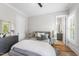 Comfortable bedroom featuring a queen bed, wood floors and ensuite bathroom at 209 Preston Retreat Ln, Cary, NC 27513