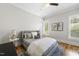 Comfortable bedroom with hardwood floors, natural light, and neutral colors at 209 Preston Retreat Ln, Cary, NC 27513