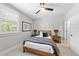 Cozy bedroom featuring neutral walls, natural light, and wood furniture at 209 Preston Retreat Ln, Cary, NC 27513