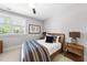 Cozy bedroom featuring neutral walls, natural light, and wood furniture at 209 Preston Retreat Ln, Cary, NC 27513