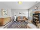 Sun-filled Bedroom features a crib, accent rug, a modern dresser, and a name sign at 209 Preston Retreat Ln, Cary, NC 27513