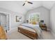 Vaulted bedroom with a ceiling fan, and large window with natural light and neutral walls at 209 Preston Retreat Ln, Cary, NC 27513