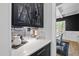 Butler's pantry with decorative backsplash, countertop space, and cabinetry at 209 Preston Retreat Ln, Cary, NC 27513