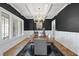 Sophisticated dining room boasts a large table, statement lighting, and stylish decor for elegant entertaining at 209 Preston Retreat Ln, Cary, NC 27513
