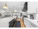 Gourmet kitchen with a large island, stainless steel appliances, and custom cabinetry at 209 Preston Retreat Ln, Cary, NC 27513