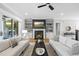 Cozy living room with a fireplace, built-in shelving and hardwood flooring at 209 Preston Retreat Ln, Cary, NC 27513