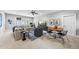 Open-concept living room featuring a cozy seating area, a dining table, and a TV for entertainment at 209 Preston Retreat Ln, Cary, NC 27513