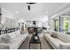 Bright living room open to the kitchen with modern decor and lots of space for entertaining guests at 209 Preston Retreat Ln, Cary, NC 27513