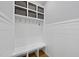 Mudroom boasts storage and bench with shiplap accent wall at 209 Preston Retreat Ln, Cary, NC 27513