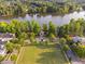 A lakeside park with a gazebo, lush trees, a well-manicured lawn, and picturesque surroundings at 210 Presidents Walk Ln, Cary, NC 27519