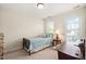 Bedroom with small bed, desk and window at 210 Presidents Walk Ln, Cary, NC 27519