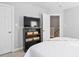Bedroom with black bookcase and open door to second floor hallway at 210 Presidents Walk Ln, Cary, NC 27519