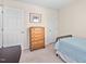 Bedroom with dresser and small bed at 210 Presidents Walk Ln, Cary, NC 27519