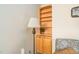 Hallway with neutral paint, built-in shelving, decorative lamp, and comfortable sofa at 210 Presidents Walk Ln, Cary, NC 27519