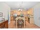 Bright kitchen features a center island with seating, stainless appliances, and plenty of cabinet storage at 210 Presidents Walk Ln, Cary, NC 27519