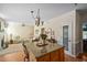 Open-concept kitchen island and living area allows seamless entertaining and bright natural light at 210 Presidents Walk Ln, Cary, NC 27519