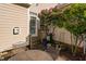Secluded patio area with garden, flowering tree, and comfortable seating, perfect for relaxing outdoors at 210 Presidents Walk Ln, Cary, NC 27519
