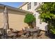 Cozy patio with comfortable seating and shade, surrounded by lush greenery and trees at 210 Presidents Walk Ln, Cary, NC 27519