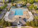 Aerial view of a community clubhouse and pool with surrounding lounge areas and pergolas at 210 Presidents Walk Ln, Cary, NC 27519