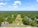 Beautiful aerial view of the community golf course with meticulously manicured greens and mature trees at 2105 Metacomet Way, Raleigh, NC 27604