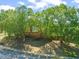 Exterior view of the Hedingham Athletic Club, framed by mature trees, showcasing a welcoming environment at 2105 Metacomet Way, Raleigh, NC 27604