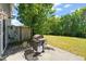 Backyard featuring a grill on the concrete patio and a fenced yard and grassy space at 2105 Metacomet Way, Raleigh, NC 27604