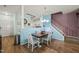 Open-concept dining area with hardwood floors and direct access to the kitchen and living room at 2105 Metacomet Way, Raleigh, NC 27604