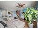 Bright living room featuring a sectional sofa, fireplace, and staircase at 2105 Metacomet Way, Raleigh, NC 27604