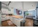Bright, open-concept kitchen with stainless steel appliances and hardwood floors at 2105 Metacomet Way, Raleigh, NC 27604