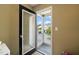 View of a patio with a black framed glass door looking out to other homes at 2105 Metacomet Way, Raleigh, NC 27604