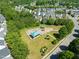 Aerial view of a community playground, featuring bright blue sunshades and various play structures for children at 2105 Metacomet Way, Raleigh, NC 27604