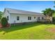 Spacious backyard with a deck and lush green grass at 215 Collins Rd, Lillington, NC 27546
