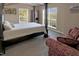 This is a view of the main bedroom with a four poster bed and seating area at 215 Collins Rd, Lillington, NC 27546