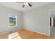 Bright bedroom with hardwood floors, natural light, and ceiling fan at 215 Collins Rd, Lillington, NC 27546