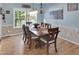 Dining room with wooden table offers plenty of seating at 215 Collins Rd, Lillington, NC 27546