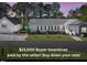 Charming single-story home with a well-manicured lawn and a separate garage, situated near a serene lake at 215 Collins Rd, Lillington, NC 27546