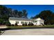 Charming, ranch-style home with a manicured lawn, stylish shutters, and a welcoming entrance at 215 Collins Rd, Lillington, NC 27546
