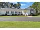Well-kept home featuring dark shutters, tidy landscaping, and a driveway leading to the front entrance at 215 Collins Rd, Lillington, NC 27546