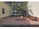 Outdoor patio with brick fire pit and wooden Adirondack chairs, perfect for entertaining with water view at 215 Collins Rd, Lillington, NC 27546