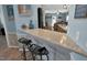 Eat-in kitchen offers granite counters, modern stools, and decor at 215 Collins Rd, Lillington, NC 27546