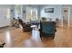 Spacious living room with hardwood floors and plenty of seating at 215 Collins Rd, Lillington, NC 27546