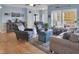 Cozy living room features hardwood floors, neutral colors, and comfortable furniture at 215 Collins Rd, Lillington, NC 27546