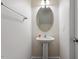 Powder room features a pedestal sink and neutral wall color at 220 Outwater Ridge Dr, Garner, NC 27529