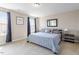 Bright bedroom featuring neutral décor, soft carpet, and ample natural light at 220 Outwater Ridge Dr, Garner, NC 27529