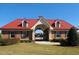 Community clubhouse featuring craftsman architecture and red metal roof at 220 Outwater Ridge Dr, Garner, NC 27529