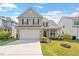 Inviting two-story home featuring a well-maintained lawn and attached two-car garage at 220 Outwater Ridge Dr, Garner, NC 27529
