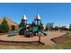 Community playground featuring multiple slides and play structures at 220 Outwater Ridge Dr, Garner, NC 27529