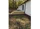 Back of house features a wooden deck with steps and some grass at 2224 Clements Dr, Durham, NC 27704