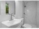 Stylish bathroom featuring marble shower, modern sink, and ample natural light at 2224 Clements Dr, Durham, NC 27704